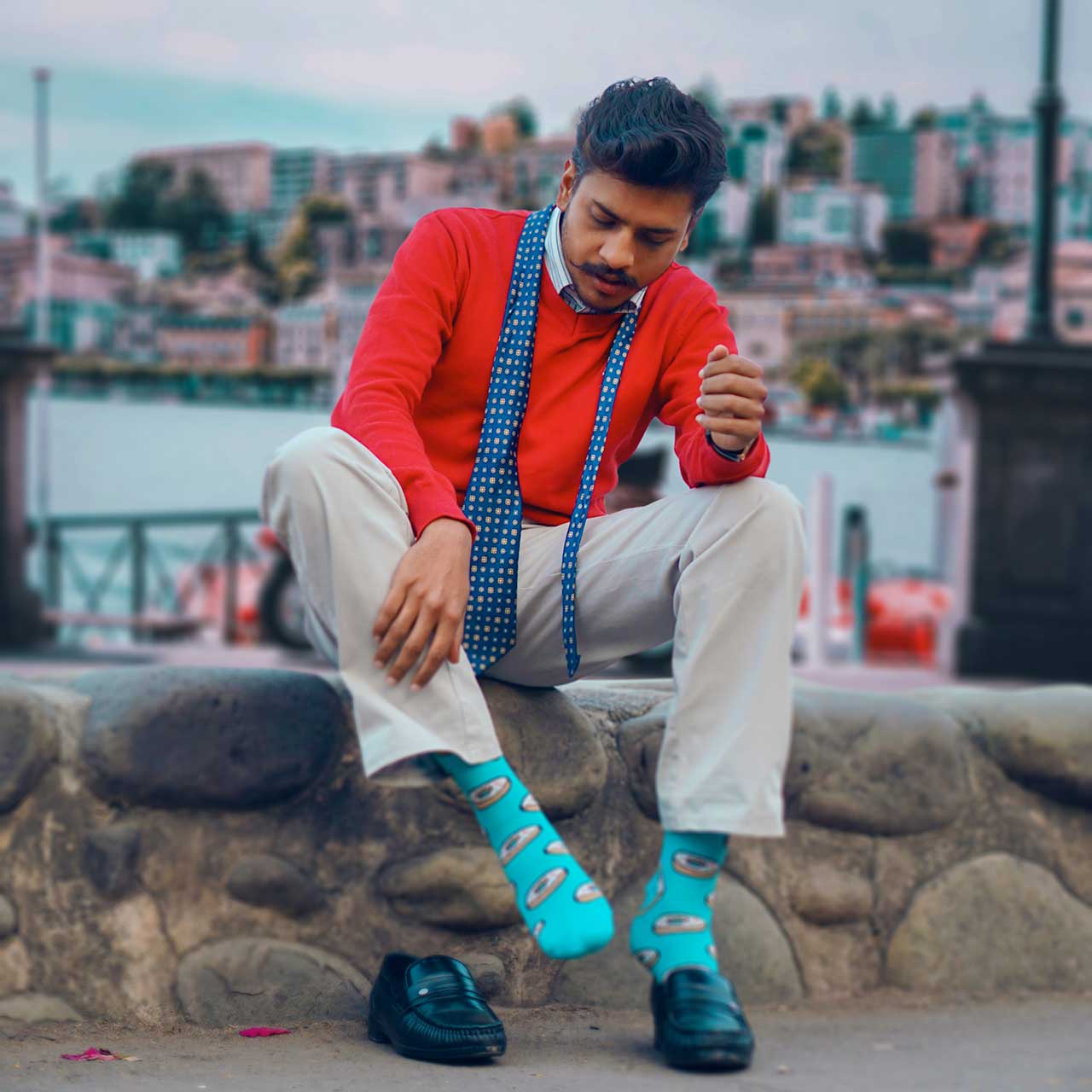 Photo of a man wearing colourful socks