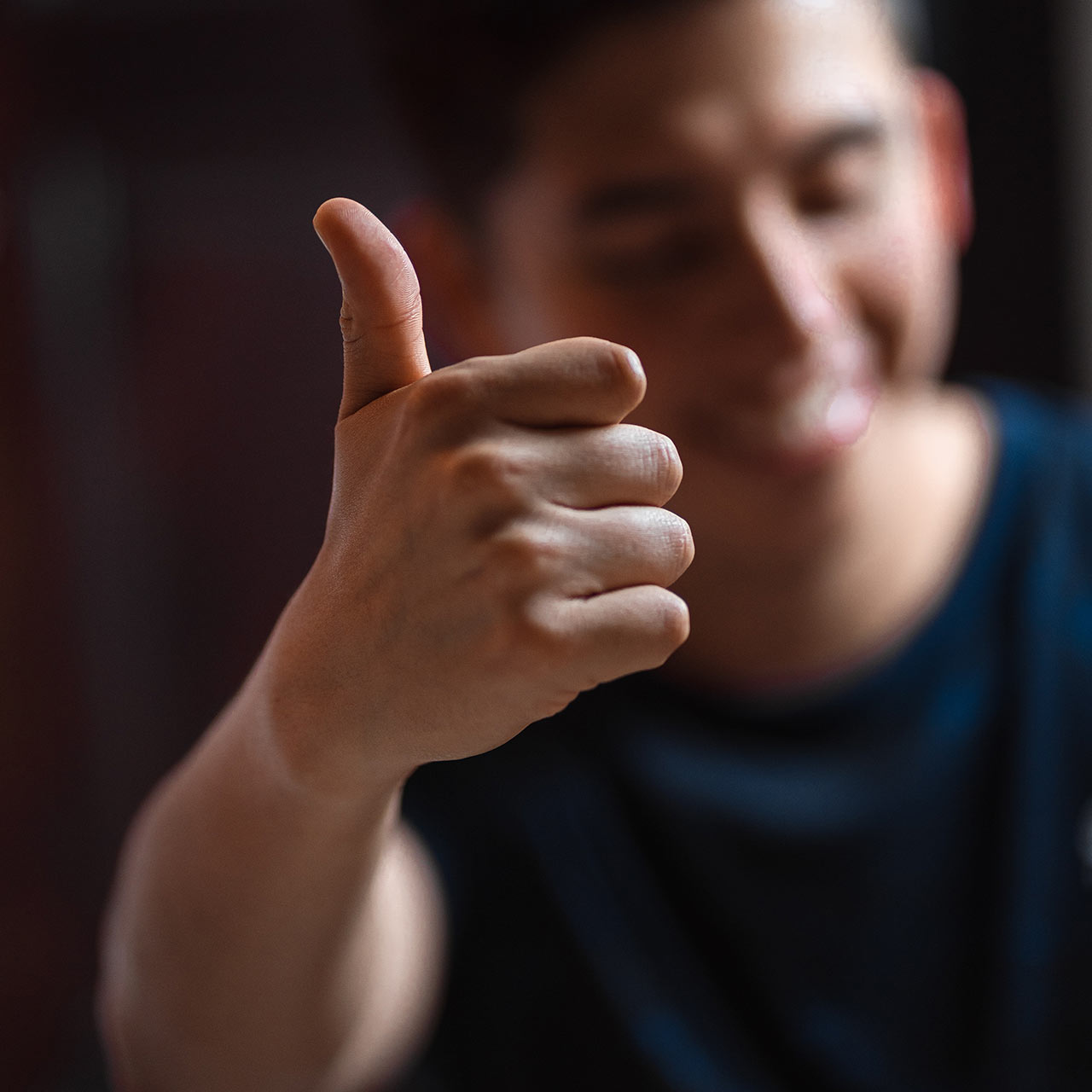 Photo of a man giving a thumbs-up